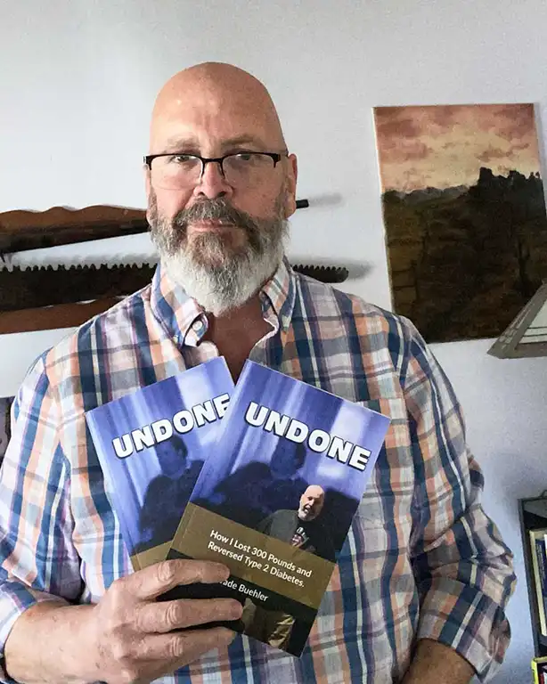 Wade Buehler Holding His Book, UNDONE.